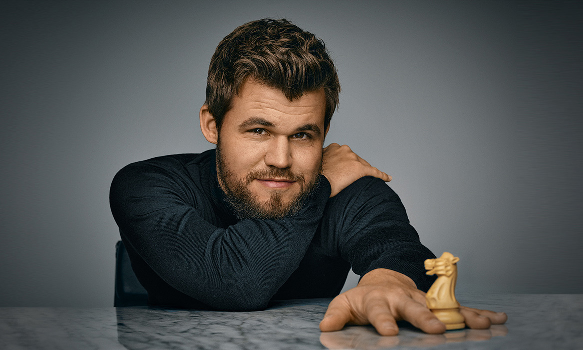 Carlsen with a knight chess piece
